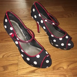 Black with white dots, some red edges