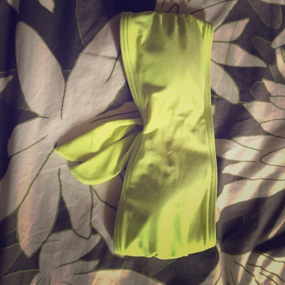 Neon yellow bathing suit top.