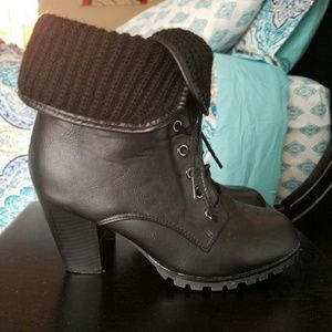 High heeled black combat boots