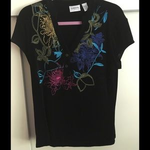 Top with embroidery flowers. Worn a few times.