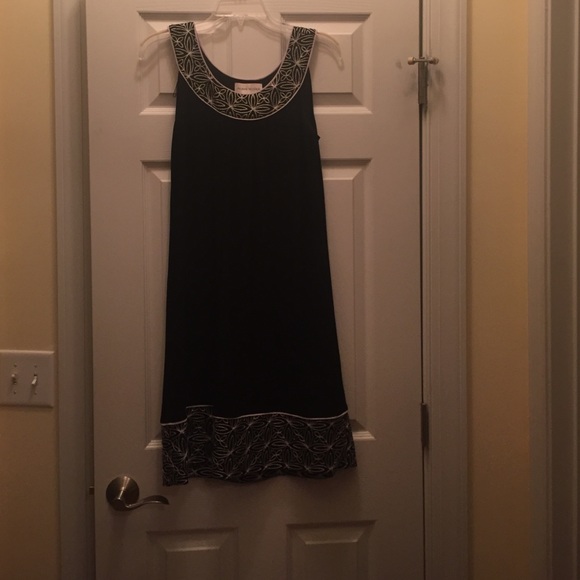 Mid length sleeveless dress.