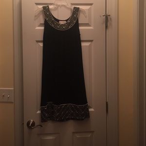 Mid length sleeveless dress.