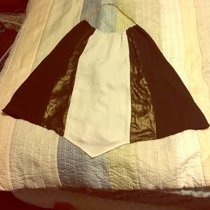 Black, white, & gold halter top with gold chain.