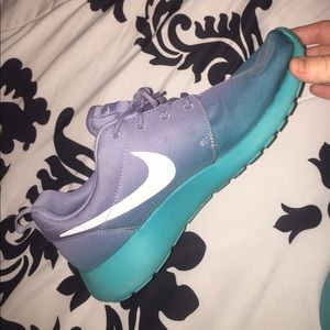 Blue and purple Nike Roshes