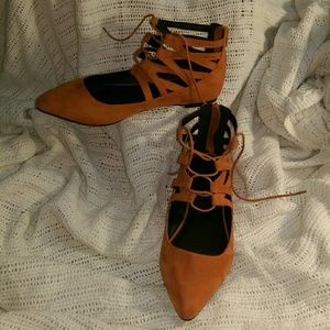 Rust orange,  faux suede ASOS brand lace-up flats.