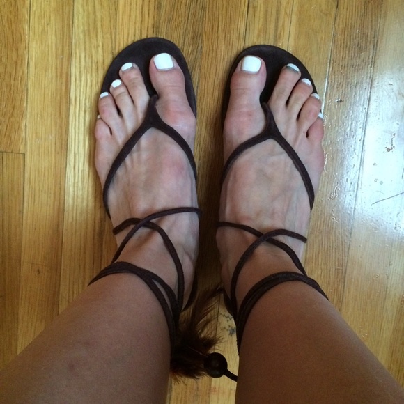 Suede lace-up sandals w/ feather and bead details!