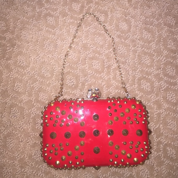 Spiked red clutch