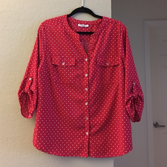 Red and white polka dotted top.