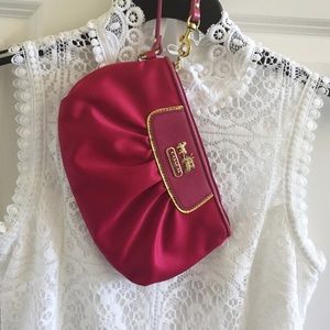 Coach fuchsia wrist bag