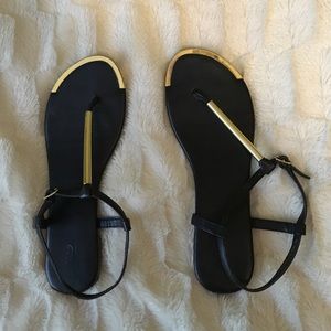Gold and black sandals