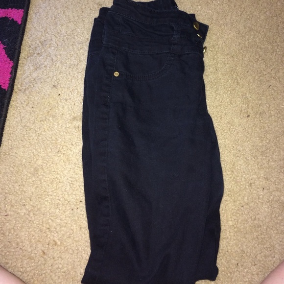 Black high waisted jeans holding for fashionlover