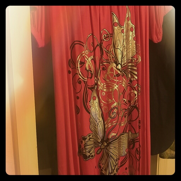 Knee length pink dress with silver butterflies.