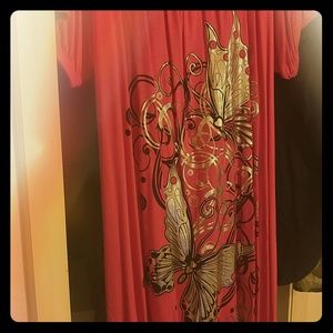 Knee length pink dress with silver butterflies.