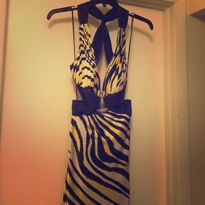 Cache floor length, open criss cross back.