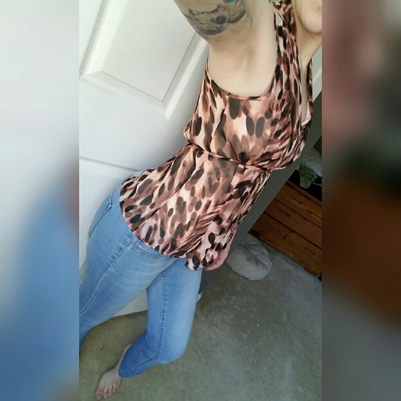 Jennifer Lopez leopard spots sleeveless blouse