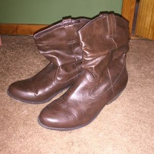 Short ankle cowboy type boots.