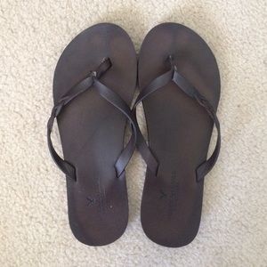 Brown flip flops