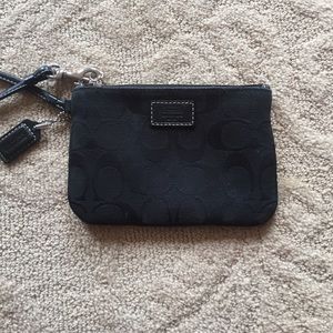 Used a few times Coach wristlet.