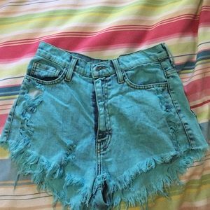 Aqua colored ripped jean shorts