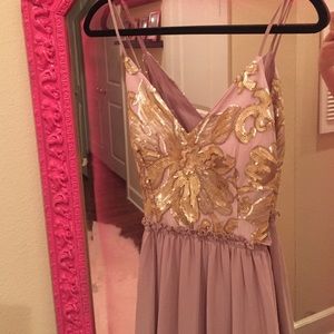 Beaded spaghetti strap open back maxi dress.