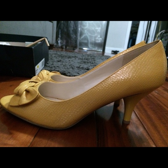 Brand new low heel yellow open toe shoes.