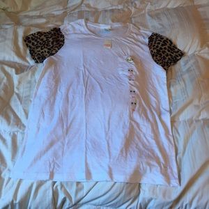Plain white pocket tee with cheetah print sleeves