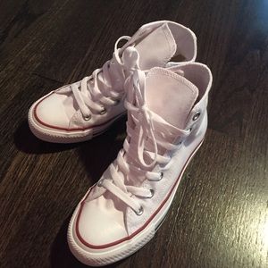 White never worn high top converse.