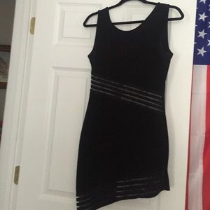 Snug black dress with mesh detailing