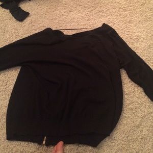 long sleeved black sweater with zipper in back