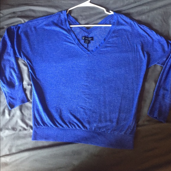 Loosely fitting blue top with silver pin stripes