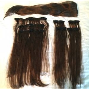 Human hair clip in extensions and section of weft