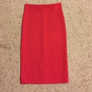 Tight fitting red skirt.
