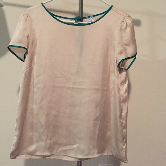 Cream blouse with green around neck and arms