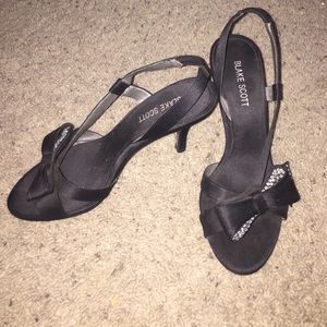 Black studded bow heels