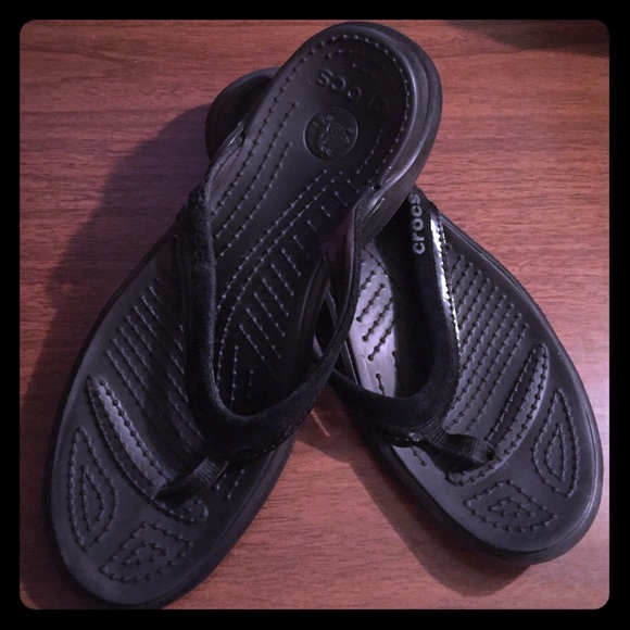 Crocs black flip flops