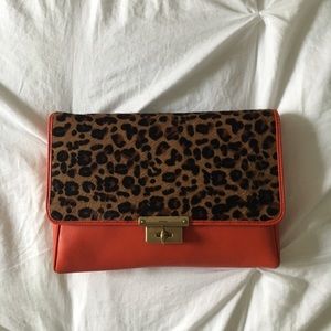 Fossil orange leopard clutch