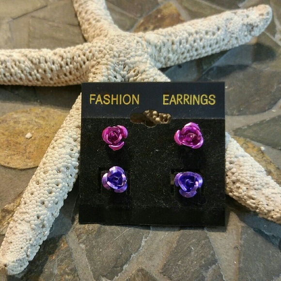Handmade metal rose studs in pink and purple.