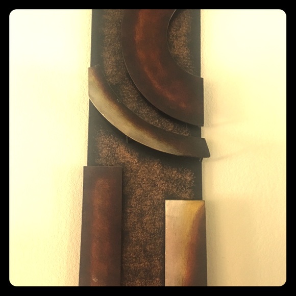 A pair of metal wall art