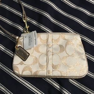 NWT Coach wristlet. Gold signature
