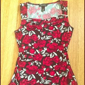 rose-patterned sleeveless blouse