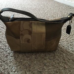 Small gold COACH bag