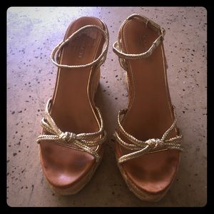 Coach gold wedges with raffia logo'd heels