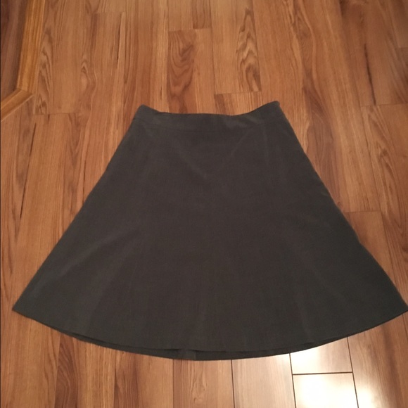 A-line knee length gray skirt.