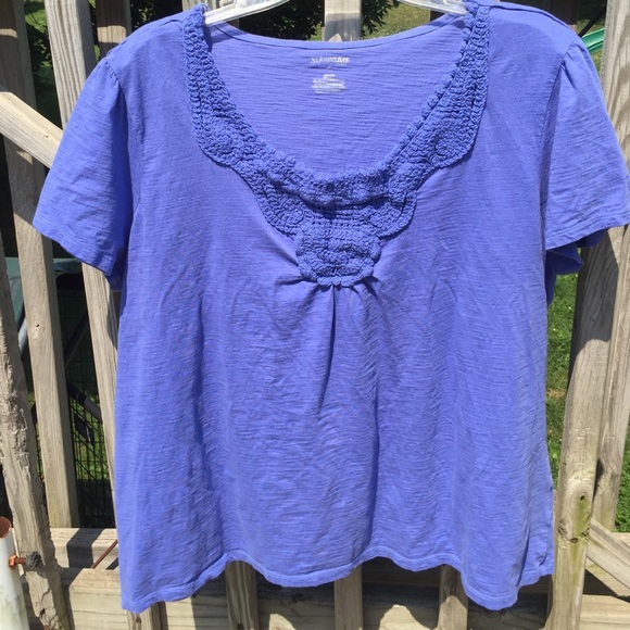 Crocheted neckline bluish/purple blouse.