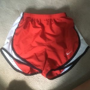 Red Nike running shorts