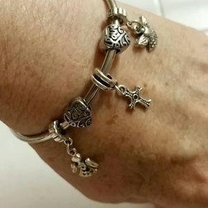 Floating charm bracelet w/ angels,  hearts & cross