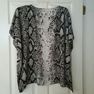 Michael kors top,  has bat wing sleeves