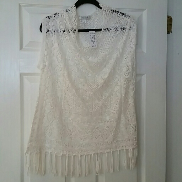 White sweater looking no sleeve top.