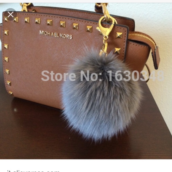 Michael Kors Accessories - Gray puff ball charm