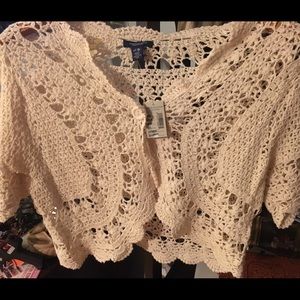 Cream scalloped bolero.